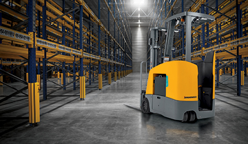 Jungheinrich lift truck in empty warehouse with shining light